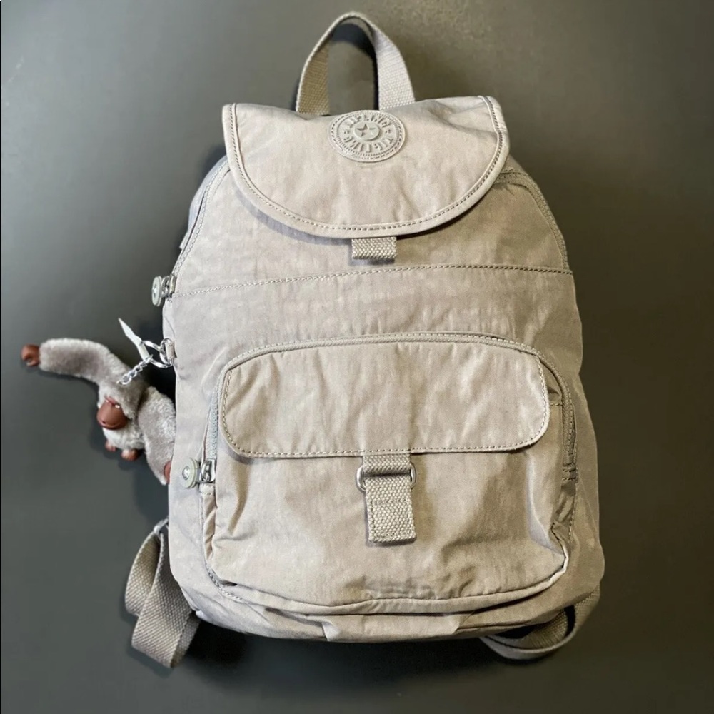 Kipling cool gray backpack.